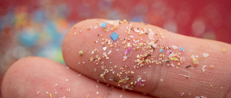 Blog of 10 Ways to Reduce Your Exposure to Microplastics which have image microplastic particles mixed in sand