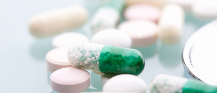 Blog of Medications Deplete Essential Vitamins and Minerals, Here’s How to Protect Yourself which have image green pill sitting on top of other pills