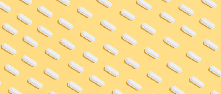 Blog of Do Probiotics Really Work? We Surveyed Probiotic Users to Find Out which have image white pills on a yellow background