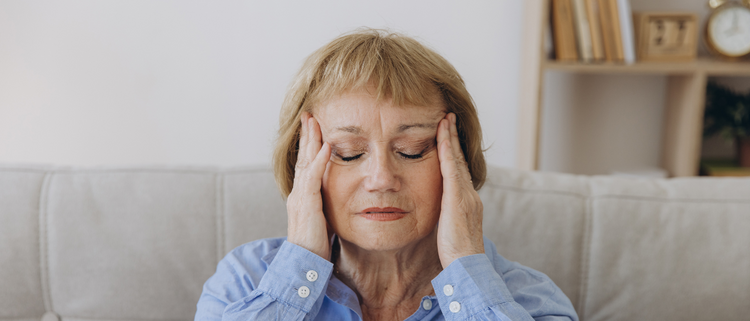 Blog of Cognitive Decline in Elderly Adults: Exploring Modern Causes and Trends which have image Woman holding her head