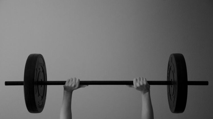 Blog of Improve Mitochondrial Function & Health: Supplements, Diet, & Habits which have image Man lifting weights