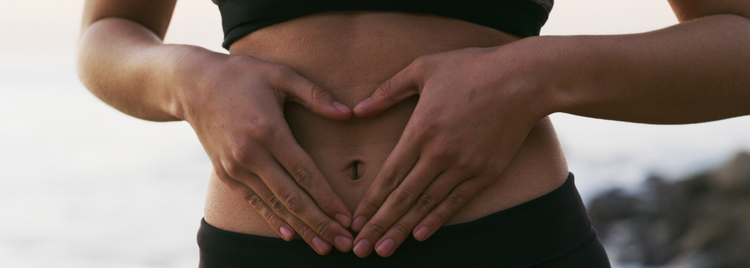 Blog of Understanding Bile Salt Malabsorption: Symptoms and Treatments which have image  Heart-shaped hands over stomach symbolizing gut health